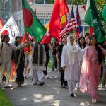 International students lead the Convocation march, proudly hoisting their countries’ flags.