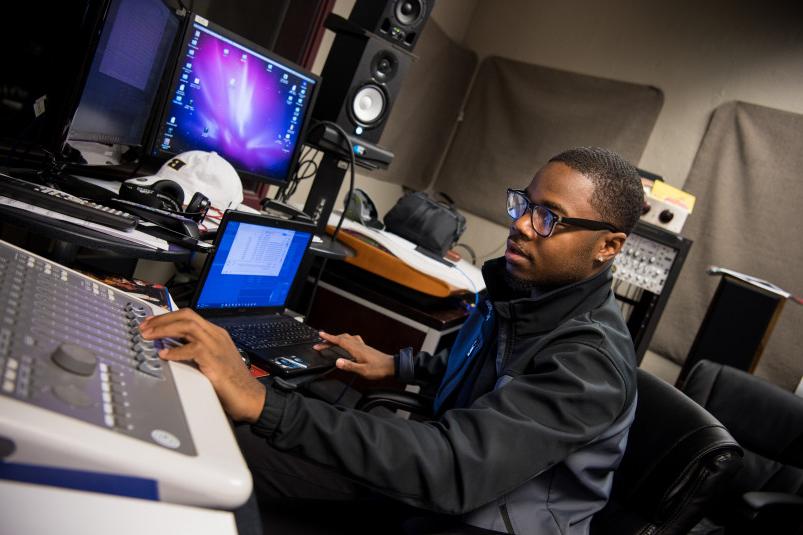 Student working with audio in the recording studio.